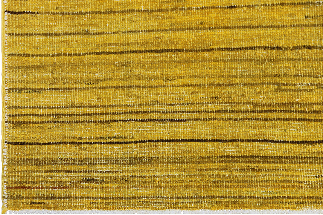 Hand-knotted wool Ariana Over-dye rug with a Mustard Gold and Brown Stria textured design, measuring 8’8” x 5’7”.