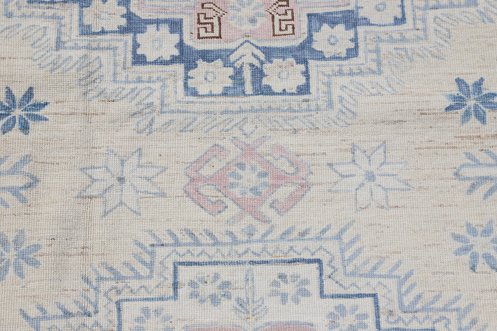 Full flat view of 6x9 blue and yellow geometric Caucasian design Afghan hand-knotted wool rug from Ariana Hazara Collection