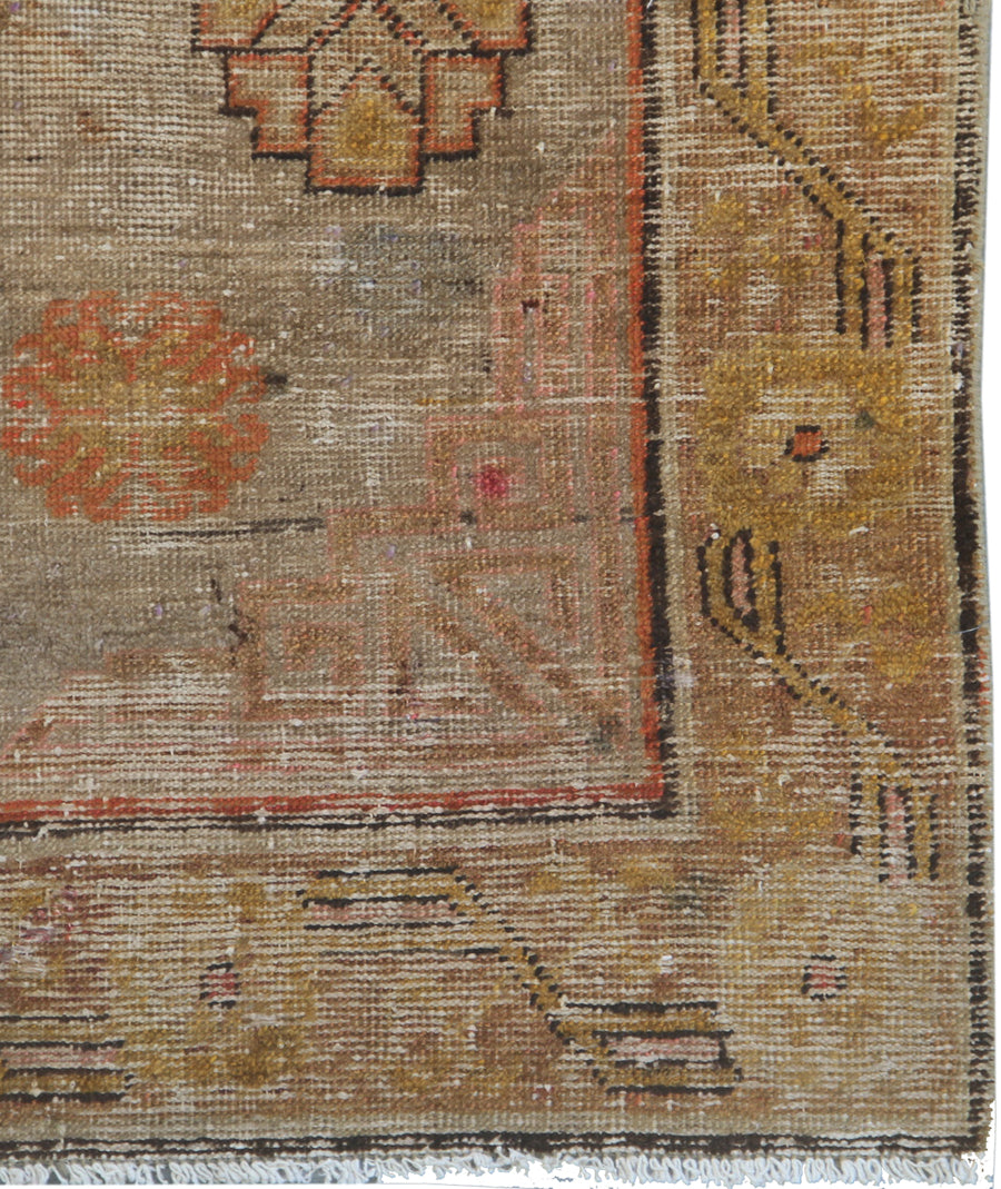 Antique Samarkand hand-knotted wool runner measuring 8'5" x 4'6" featuring an antique red medallion design on a grey, orange, and gold color palette.