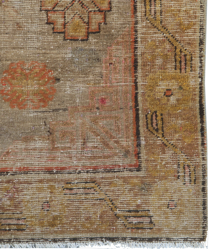 Antique Samarkand hand-knotted wool runner measuring 8'5" x 4'6" featuring an antique red medallion design on a grey, orange, and gold color palette.