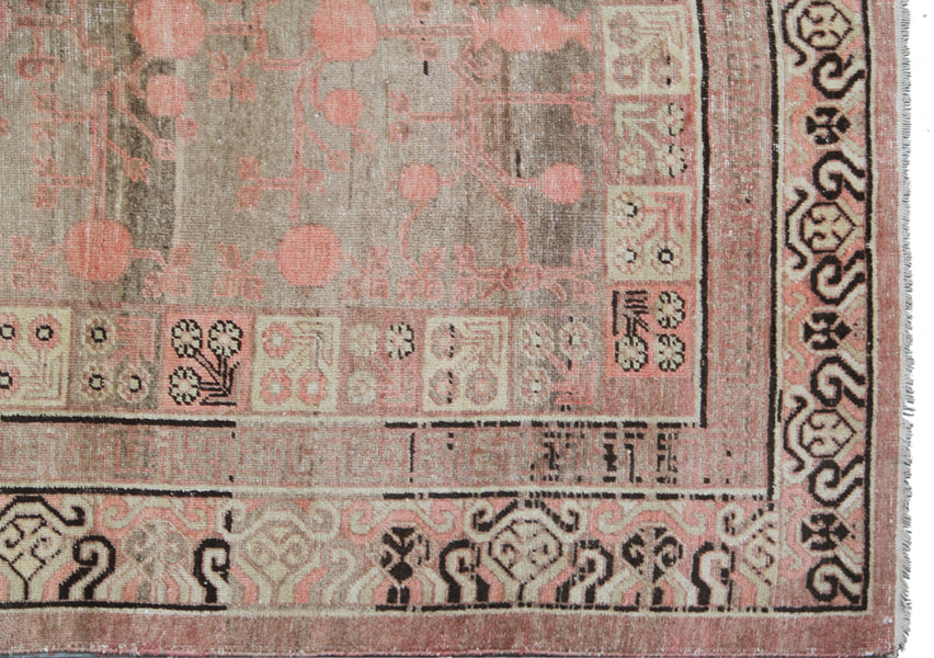 Extra-large antique East Turkistan Samarkand wool rug measuring 7'11" x 16'1" featuring a pomegranate botanical design in grey, pink, brown, beige, and black.