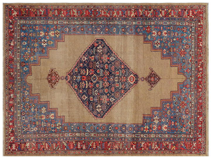 An antique wool camel hair rug with blue and red geometric medallions and a beige border.