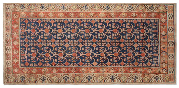 Rare 6x11 antique Samarkand hand-knotted wool area rug featuring red pomegranate motifs on a deep navy blue background by Ariana Rugs.