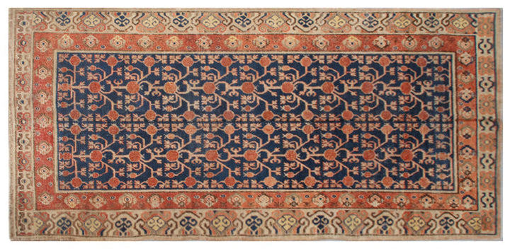 Rare 6x11 antique Samarkand hand-knotted wool area rug featuring red pomegranate motifs on a deep navy blue background by Ariana Rugs.