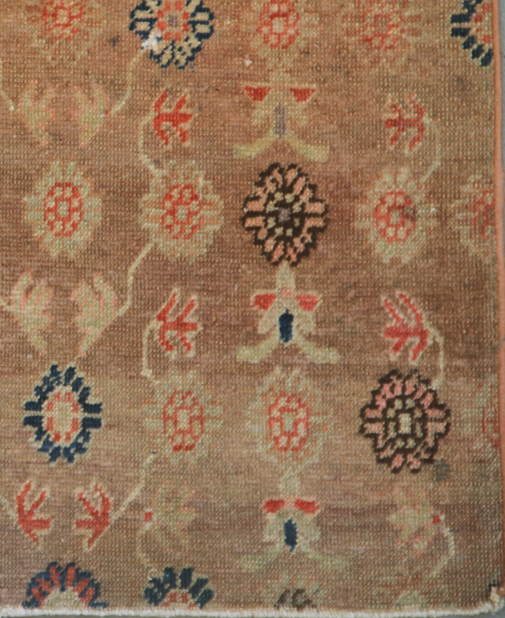 Distressed 4x7 antique Samarkand hand-knotted wool area rug featuring a peach terracotta background with visible historic wear by Ariana Rugs.