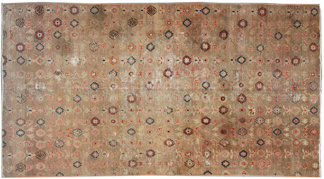 Distressed 4x7 antique Samarkand hand-knotted wool area rug featuring a peach terracotta background with visible historic wear by Ariana Rugs.