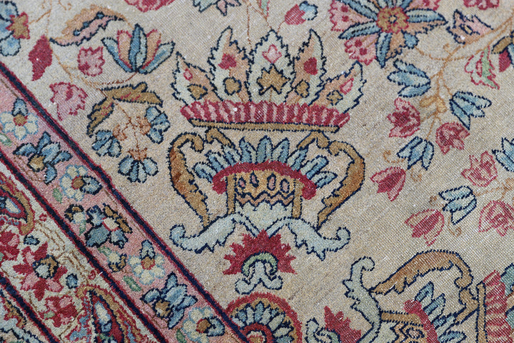 10'x16' antique Persian Kerman floral rug in gold, pink, blue, and ivory with authentic low pile from Ariana Rugs