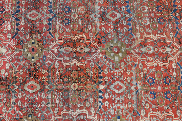 9x12 antique Persian Mahal rug with terracotta rust ground, navy blue geometric border, and ivory details