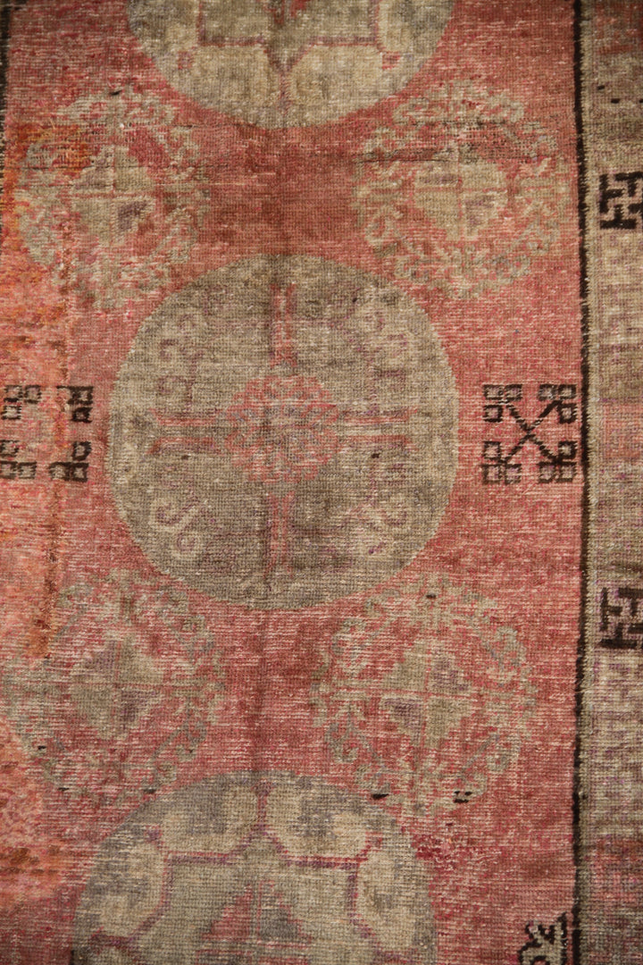 Rare 4x8 antique Samarkand hand-knotted wool area rug featuring three central motifs on a gentle pink and beige field by Ariana Rugs.