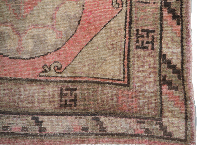 Rare 4x8 antique Samarkand hand-knotted wool area rug featuring three central motifs on a gentle pink and beige field by Ariana Rugs.