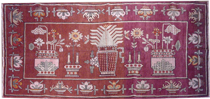 Rare 5x9 antique Yarkand Samarkand hand-knotted wool rug featuring a vase design on a reddish-purple abrash field by Ariana Rugs.
