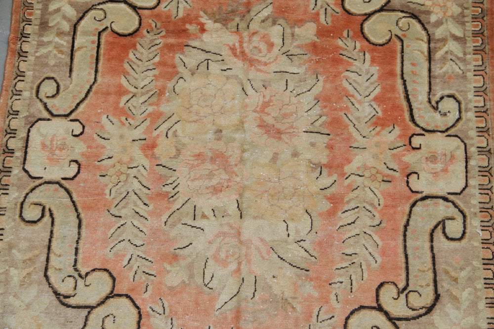 Antique Samarkand Yarkand hand-knotted wool rug measuring 9'1" x 5'5" featuring a French floral design in orange, pink, ivory, brown, and green tones.