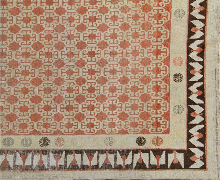 Antique Samarkand hand-knotted wool rug measuring 8'9" x 5'4" featuring a bold geometric design in red, dark brown, and ivory tones.