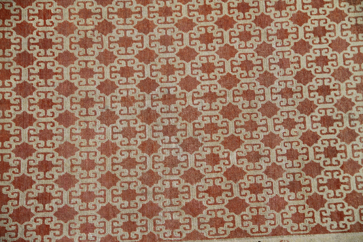 Antique Samarkand hand-knotted wool rug measuring 8'9" x 5'4" featuring a bold geometric design in red, dark brown, and ivory tones.