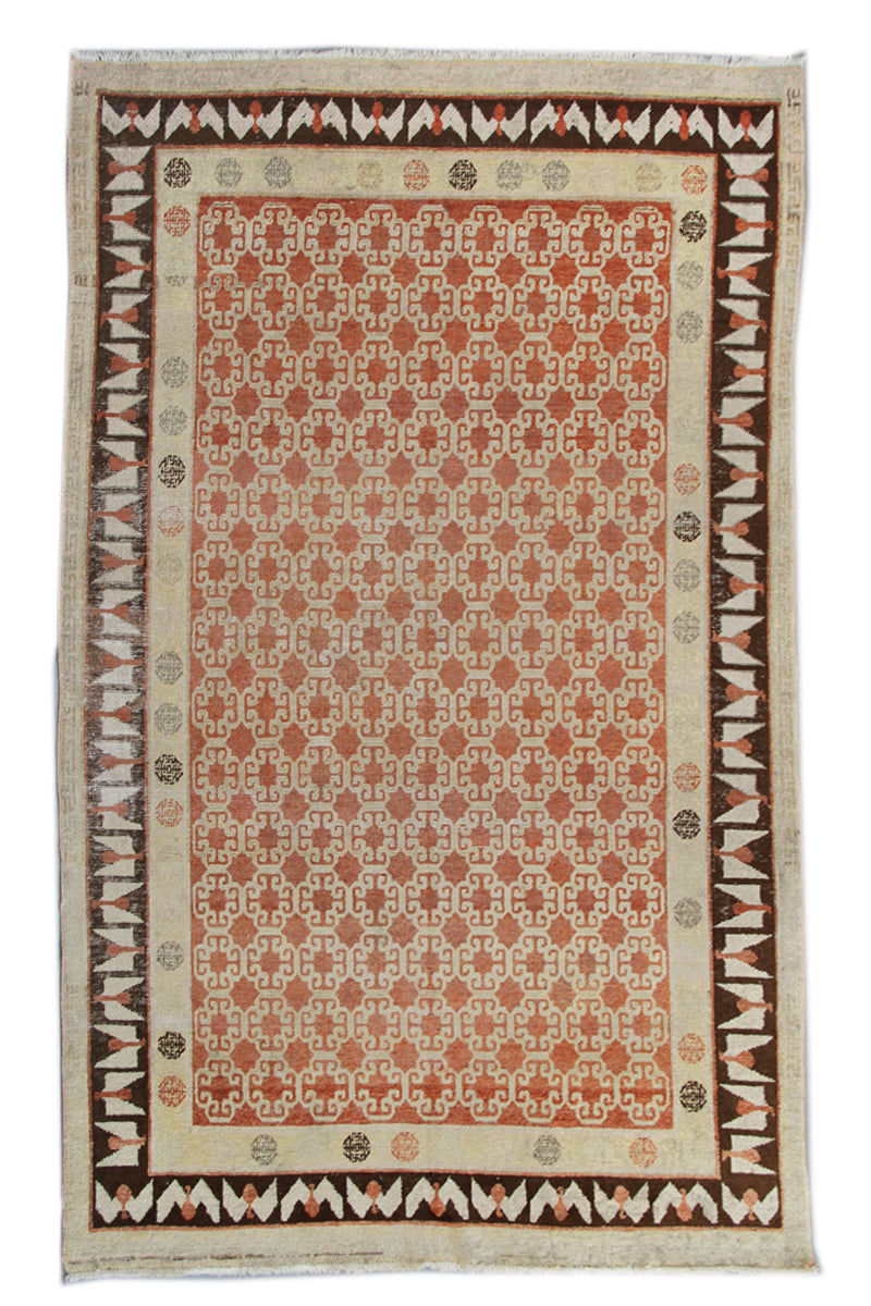 Antique Samarkand hand-knotted wool rug measuring 8'9" x 5'4" featuring a bold geometric design in red, dark brown, and ivory tones.