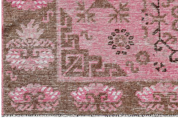 Antique Samarkand wool runner measuring 3'10" x 7'10" featuring an allover design in hot pink and brown tones.