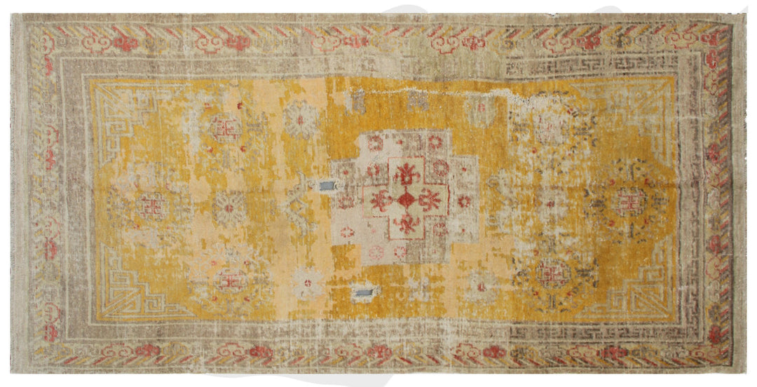 Authentic antique hand-knotted Samarkand Khotan wool area rug in rich gold and orange tones with low pile distressed character