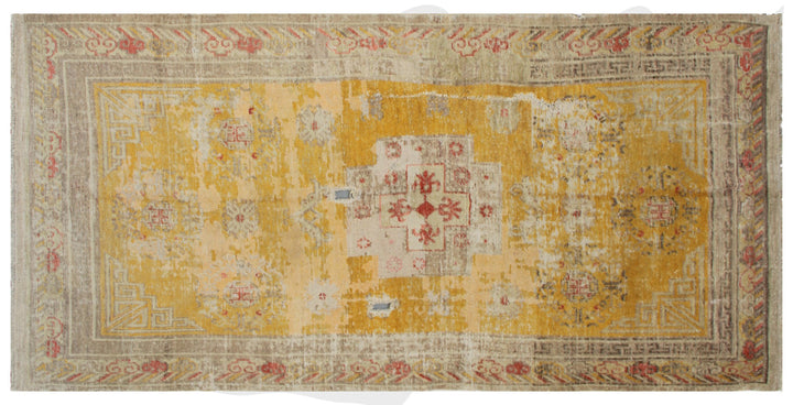 Authentic antique hand-knotted Samarkand Khotan wool area rug in rich gold and orange tones with low pile distressed character