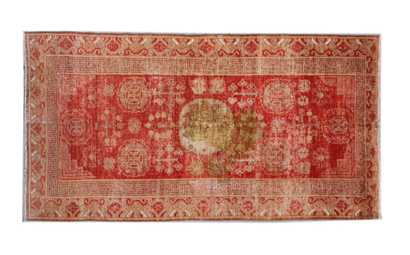 Authentic antique hand-knotted Samarkand Khotan wool area rug featuring classic medallions in grey and soft tan on a rich red field