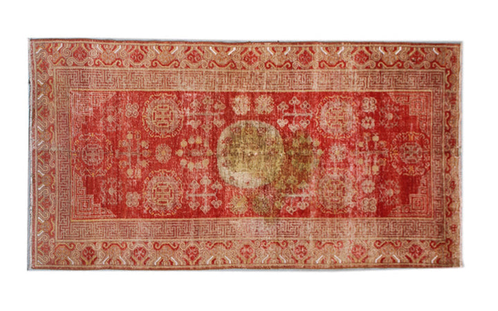 Authentic antique hand-knotted Samarkand Khotan wool area rug featuring classic medallions in grey and soft tan on a rich red field