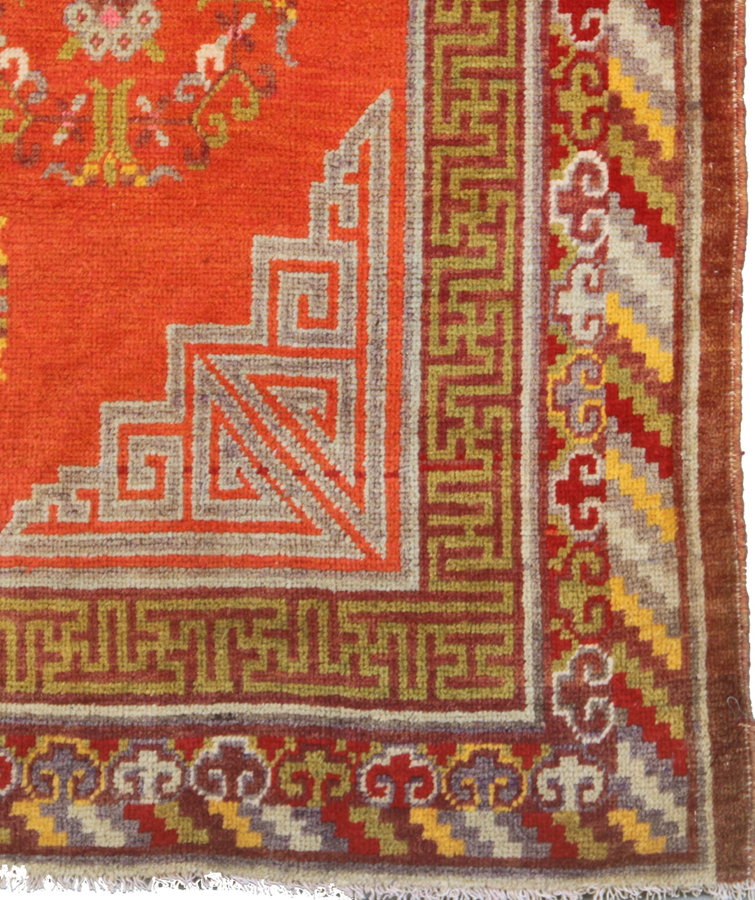 Authentic antique hand-knotted Samarkand Khotan wool area rug featuring a central medallion on a rich red field