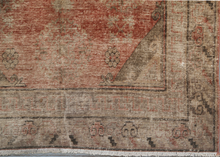 Authentic antique hand-knotted Samarkand Khotan wool area rug featuring classic motifs on a warm rust red field with deep brown accents