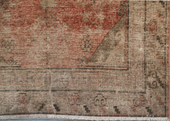 Authentic antique hand-knotted Samarkand Khotan wool area rug featuring classic motifs on a warm rust red field with deep brown accents
