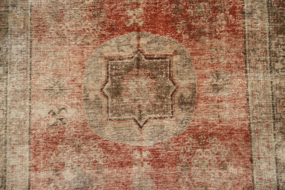 Authentic antique hand-knotted Samarkand Khotan wool area rug featuring classic motifs on a warm rust red field with deep brown accents