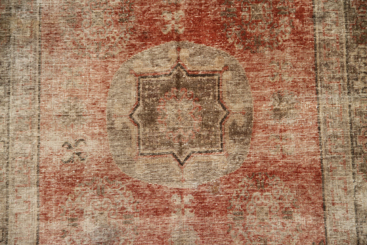 Authentic antique hand-knotted Samarkand Khotan wool area rug featuring classic motifs on a warm rust red field with deep brown accents