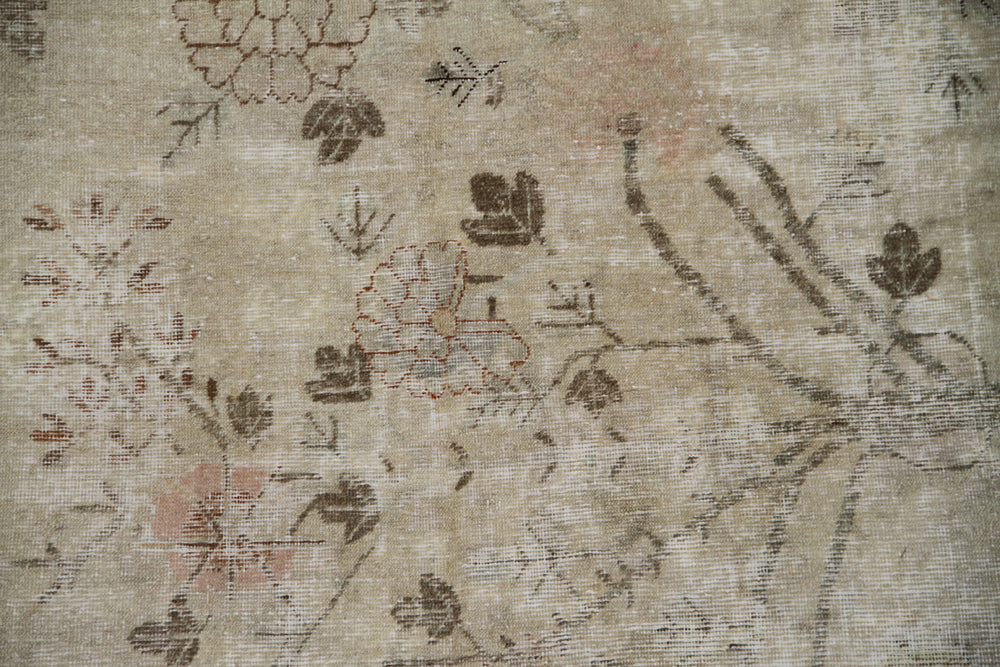 Authentic 2nd quarter 20th century antique hand-knotted Samarkand Khotan wool rug with distressed washed-out pink brown and beige botanical design