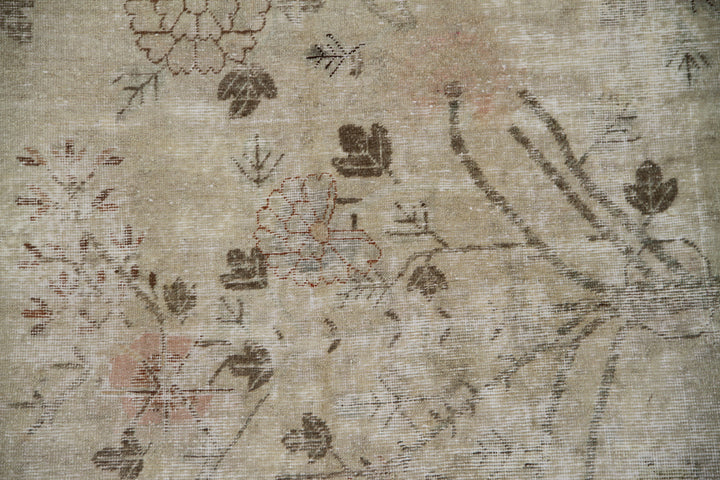 Authentic 2nd quarter 20th century antique hand-knotted Samarkand Khotan wool rug with distressed washed-out pink brown and beige botanical design