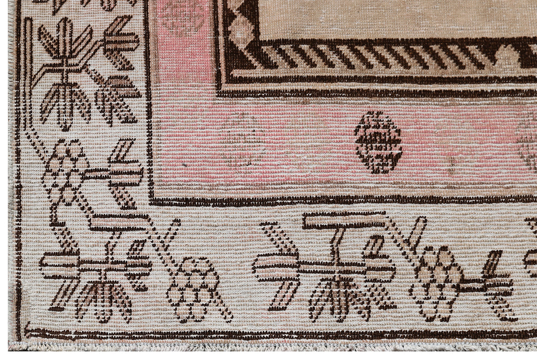 Antique Samarkand wool rug measuring 8'6" x 5'3" featuring a classic vase design in a pink, brown, and beige color palette.
