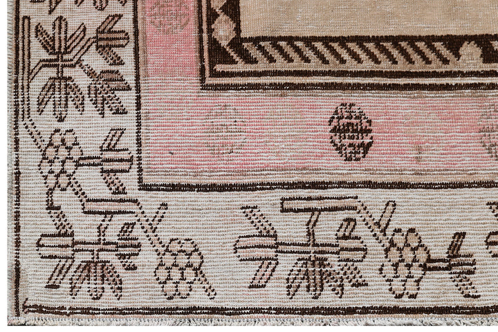 Antique Samarkand wool rug measuring 8'6" x 5'3" featuring a classic vase design in a pink, brown, and beige color palette.