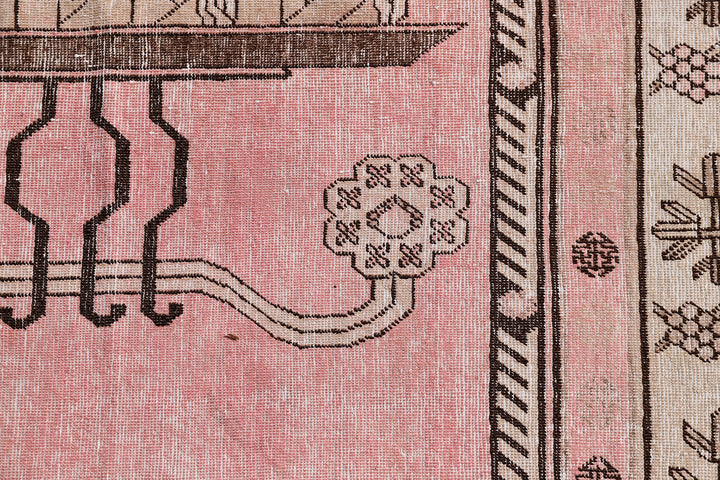 Antique Samarkand wool rug measuring 8'6" x 5'3" featuring a classic vase design in a pink, brown, and beige color palette.