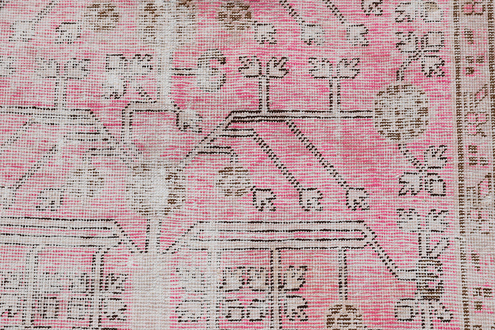 Antique Samarkand Khotan wool rug measuring 5'2" x 4'0" featuring a delicate pink floral design and vintage patina.