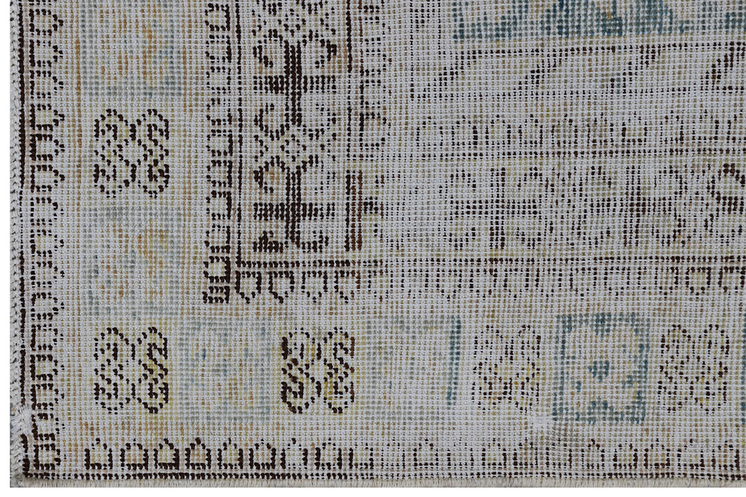 Antique Samarkand hand-knotted wool rug measuring 5'7" x 11'1" featuring a pomegranate overall design on a grey-green background with blue, cream, and brown tones.