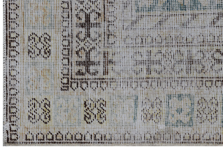 Antique Samarkand hand-knotted wool rug measuring 5'7" x 11'1" featuring a pomegranate overall design on a grey-green background with blue, cream, and brown tones.