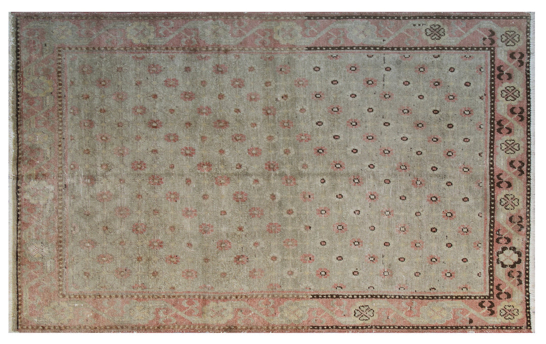 Rare 4x7 antique Samarkand hand-knotted wool rug featuring pink terracotta flowers on a soft green background by Ariana Rugs.