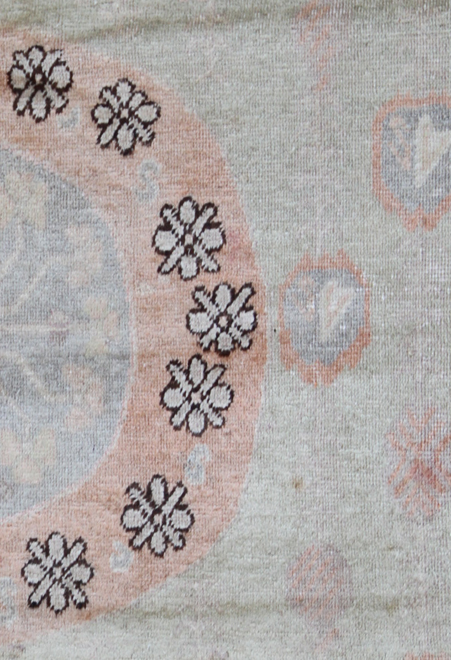 Rare 4x13 antique Samarkand hand-knotted wool gallery runner rug featuring orange medallions on a soft grey background by Ariana Rugs.
