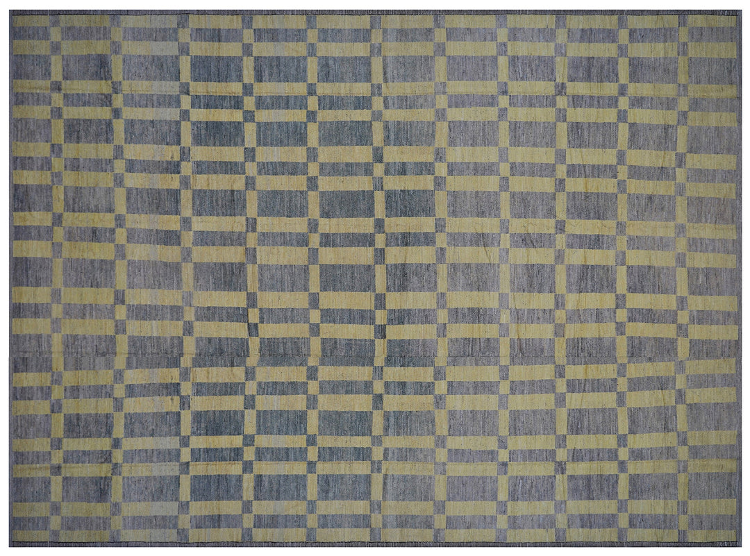 An overhead view of a massive 16x20 authentic Moroccan style long pile shag rug from the Ariana Barchi Collection, featuring a grey and yellow geometric pattern hand-woven by Hazara women weavers.