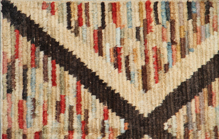Hand-crafted 9'3" x 6'3" Moroccan Barchi wool area rug featuring a brown geometric diamond pattern over a vibrant striped background with plush long pile.