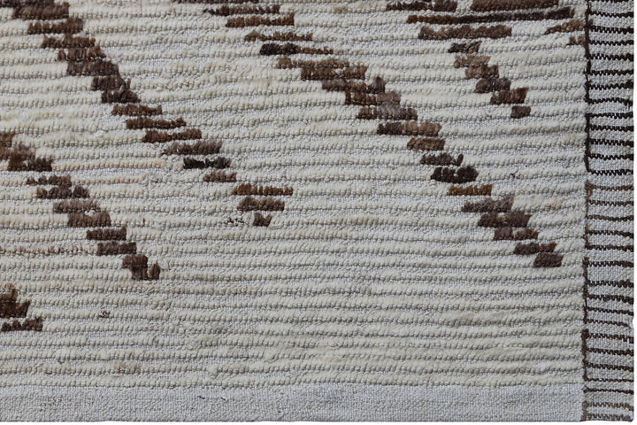 Hand-crafted 15'5" x 12'7" oversized Moroccan-style shag wool on cotton area rug featuring a brown and ivory zebra pattern from the Ariana Barchi Collection.