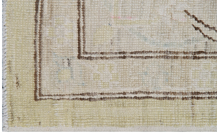 Authentic Ariana Traditional Collection 6x9 area rug featuring a fine luxury Polonaise floral design in a soft yellow, ivory, and brown color palette with woven silk highlights, hand-knotted in Afghanistan.