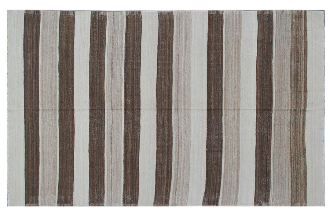 Organic modern sitting room styled with a 6x10 earth-tone brown, tan, and cream striped Afghan wool kilim from Ariana Rugs West Hollywood.