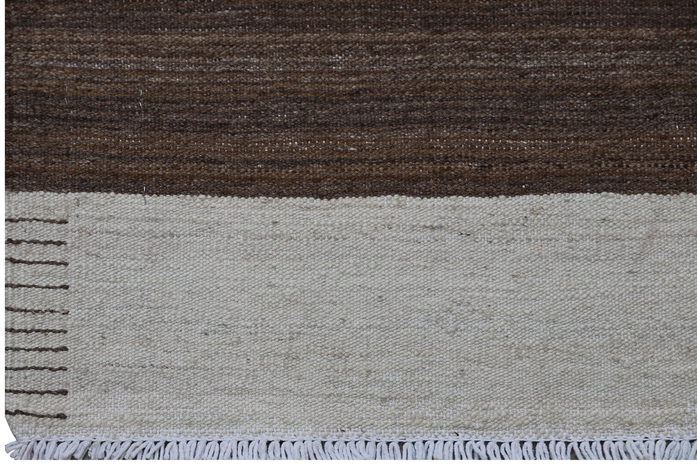 Close-up of organic hand-spun wool weave showing wide ivory and brown striped detail on Afghan kilim by Hazara weavers.