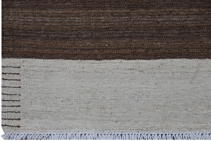 Close-up of organic hand-spun wool weave showing wide ivory and brown striped detail on Afghan kilim by Hazara weavers.