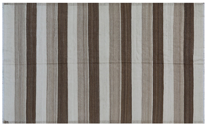 Close-up of organic hand-spun wool weave showing wide ivory and brown striped detail on Afghan kilim by Hazara weavers.