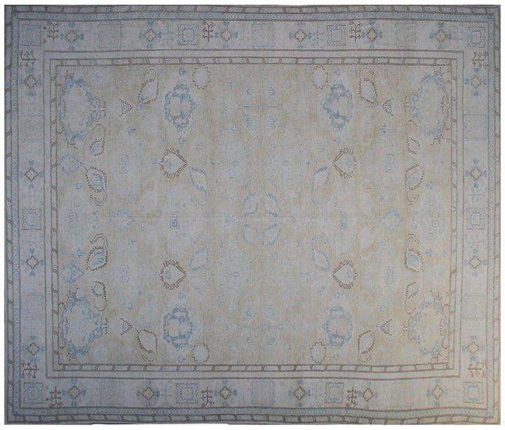 Ariana large Caucasian design wool rug in ivory and pale blue, hand-knotted in Afghanistan by Hazara artisans. Luxury oversized geometric area rug for elegant interiors.