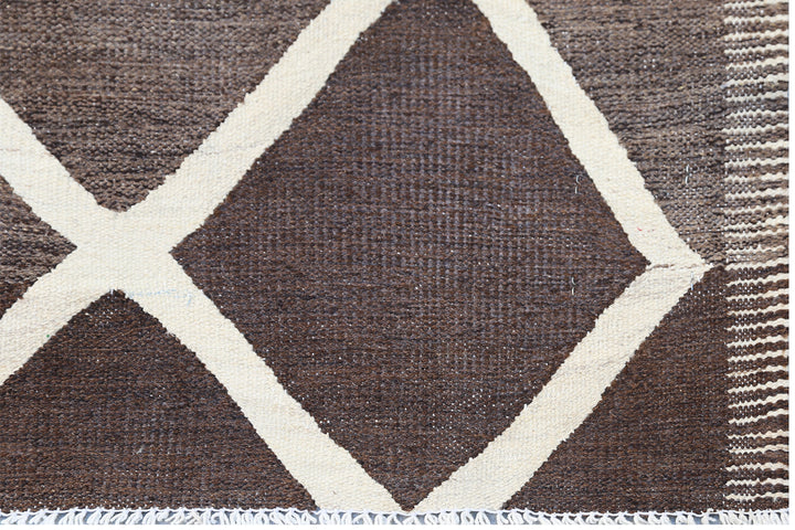 Ariana Rugs 10'x14' handwoven brown and ivory wool kilim area rug featuring an organic flatweave structure on a natural wool foundation.