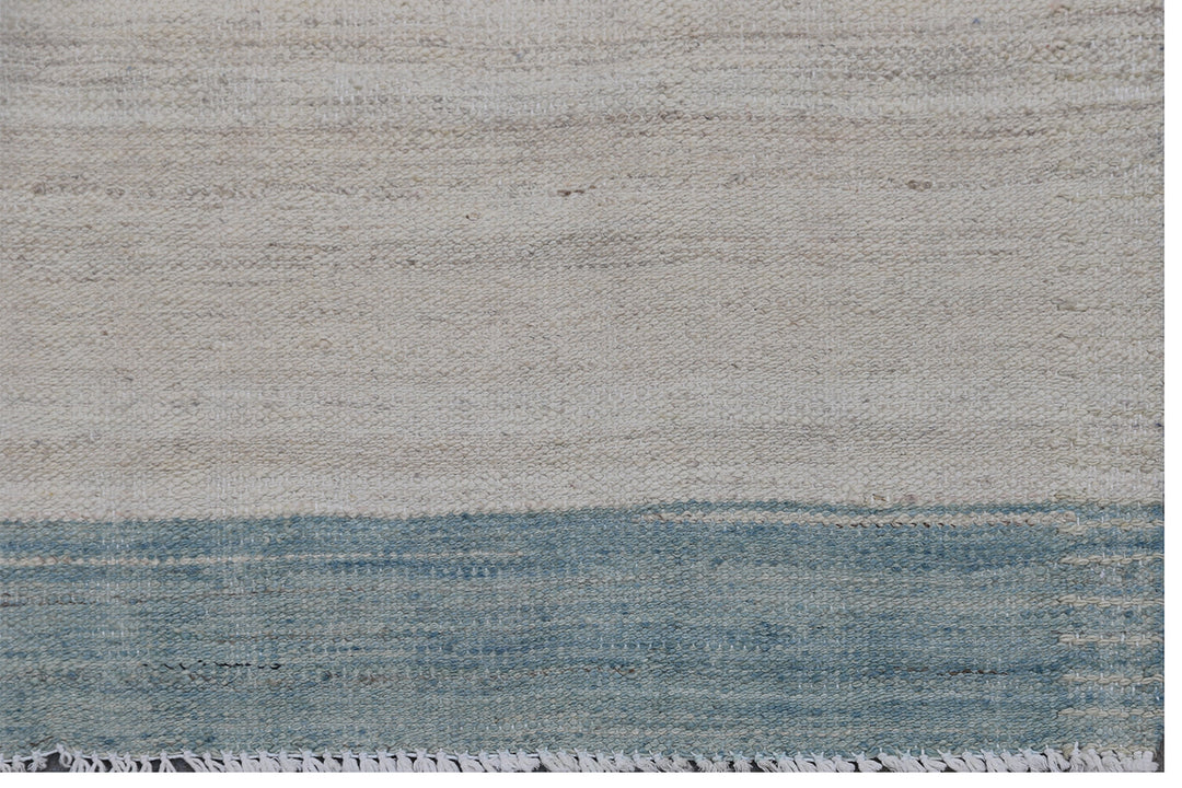 Ariana Rugs 6'x10' fine handwoven blue, ivory, and cream striped wool kilim area rug crafted in Afghanistan on a cotton foundation.
